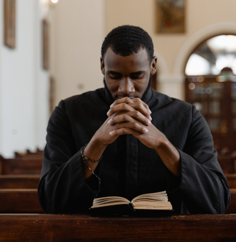 Black-man-praying-at-church