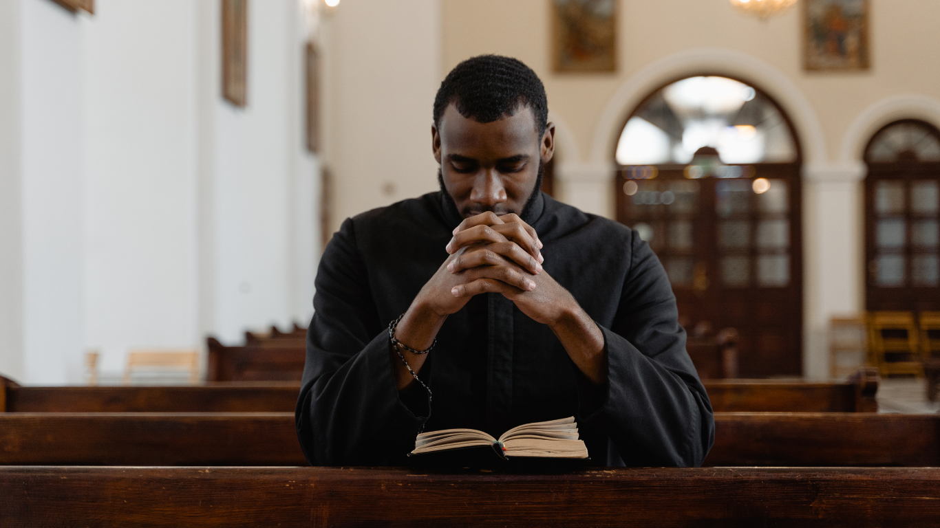 Black-man-praying-at-church